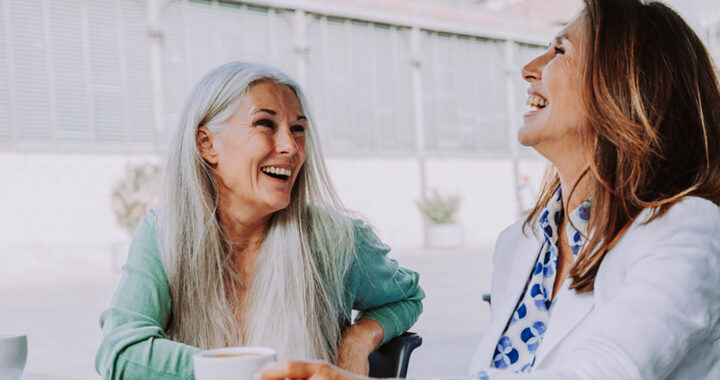 Beautiful senior women meeting outdoors in the city