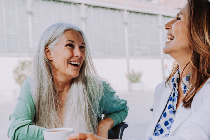 Beautiful senior women meeting outdoors in the city